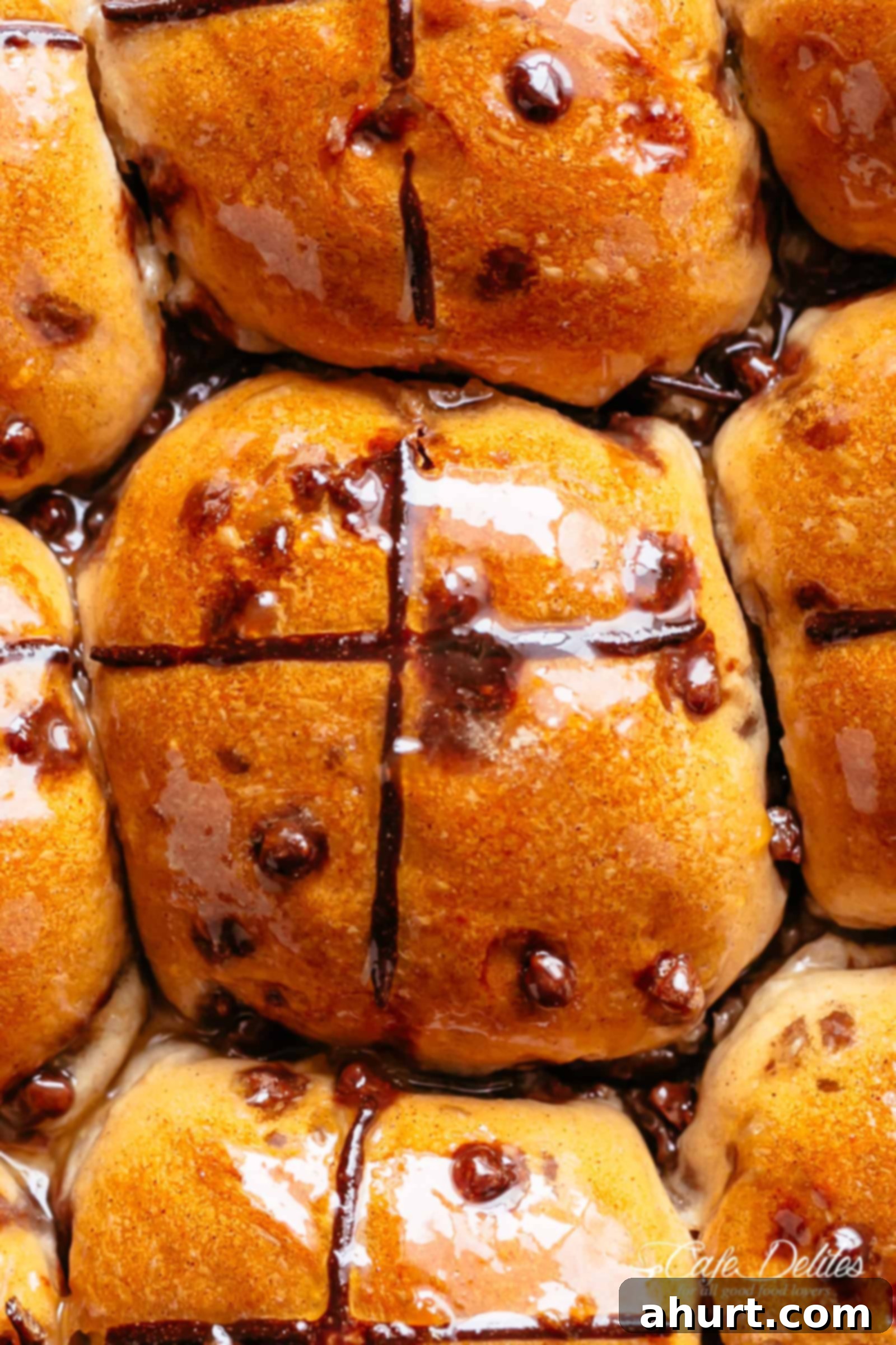 Fluffy and fragrant homemade hot cross buns filled with melted chocolate chips are better than store bought! 