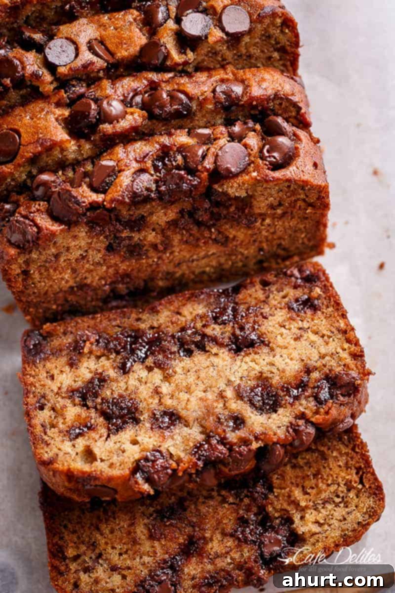 The Ultimate Chocolate Chip Banana Bread 2 Image of moist banana bread slices with chocolate chips
