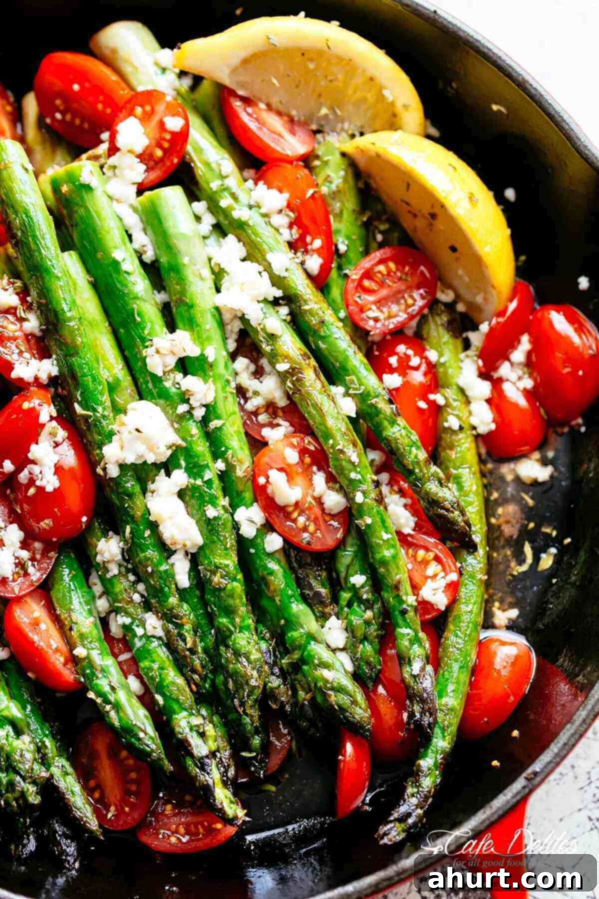 Lemon Garlic Asparagus | cafedelites.com Lemon Garlic Asparagus topped feta cheese, tomatoes and drizzled with Mediterranean flavours