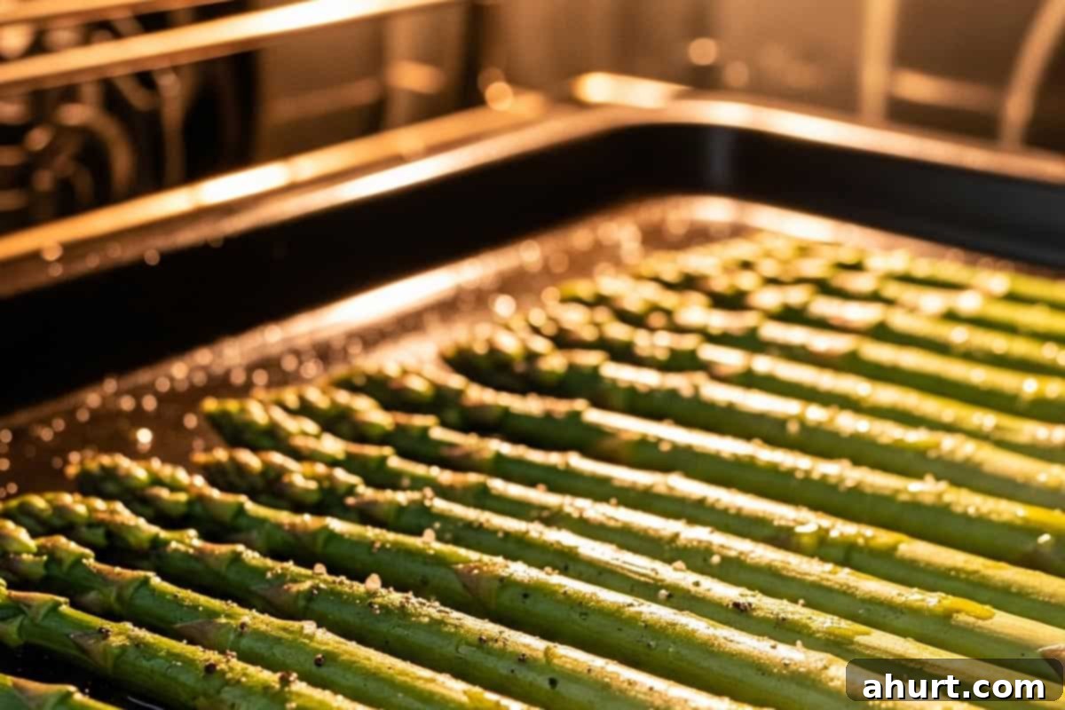 Effortless Lemon Garlic Asparagus 6 Asparagus on a baking sheet.