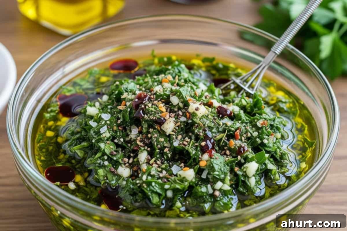 Zesty Chimichurri Steak 3 Mixed olive oil, red wine vinegar, parsley, garlic, chili, oregano, salt, and pepper in a bowl.