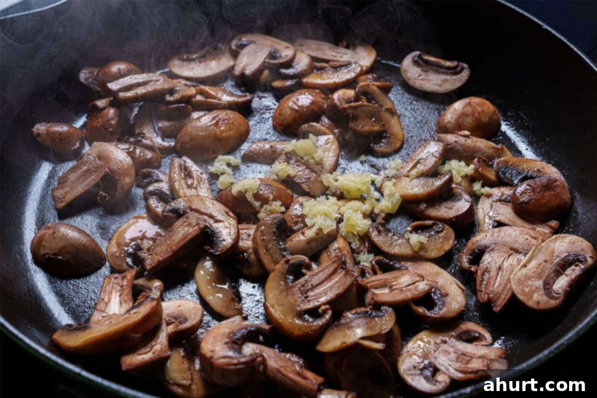 Velvety Chicken Marsala Made Simple 6 An image of garlic being added to the pan and cooked until fragrant for about one minute.