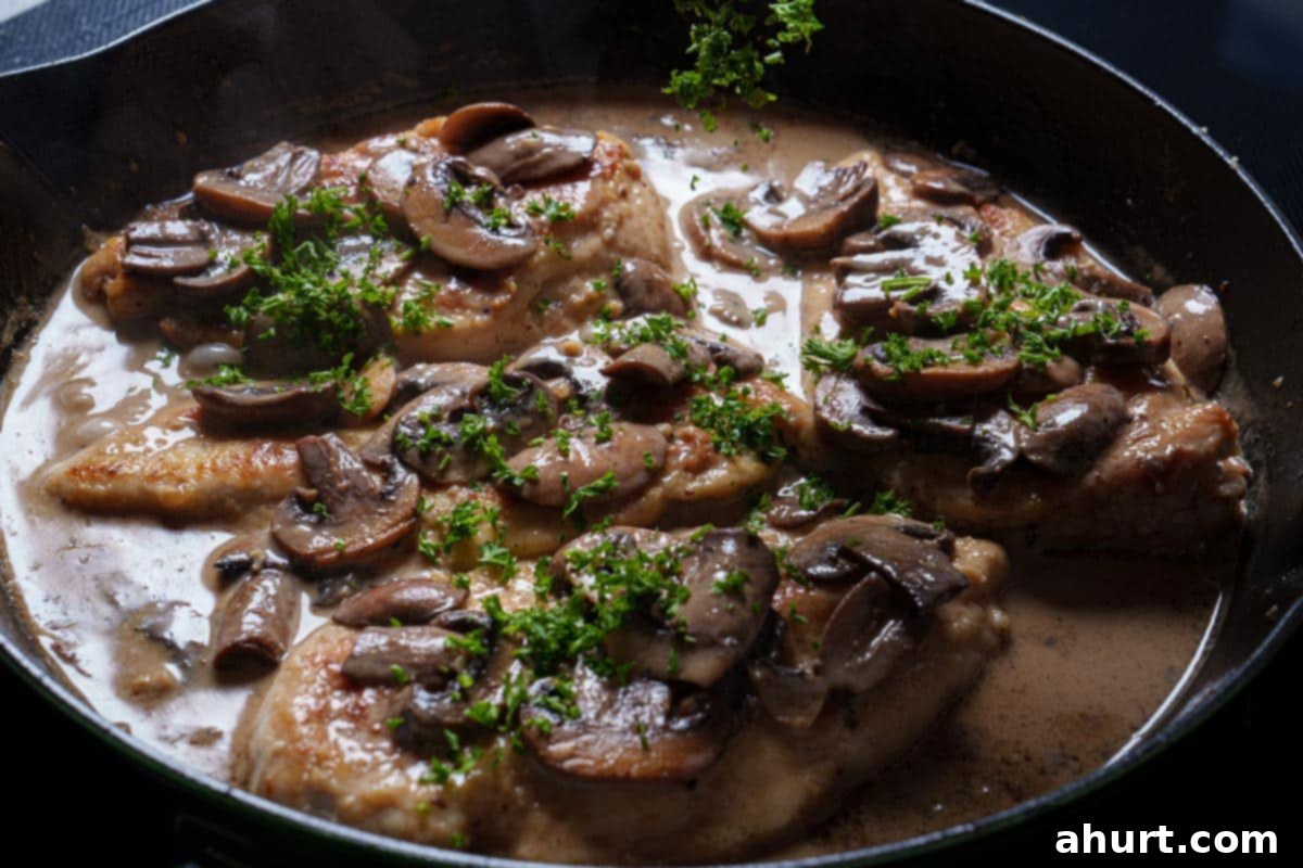 Velvety Chicken Marsala Made Simple 8 Image of the chicken being returned to the pan to finish cooking.
