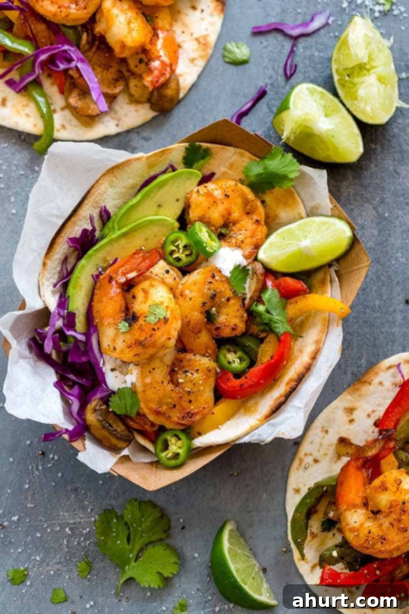 Fiery Shrimp Fajitas 12 spicy shrimp fajita tacos served in paper trays with lime wedges and fresh cilantro