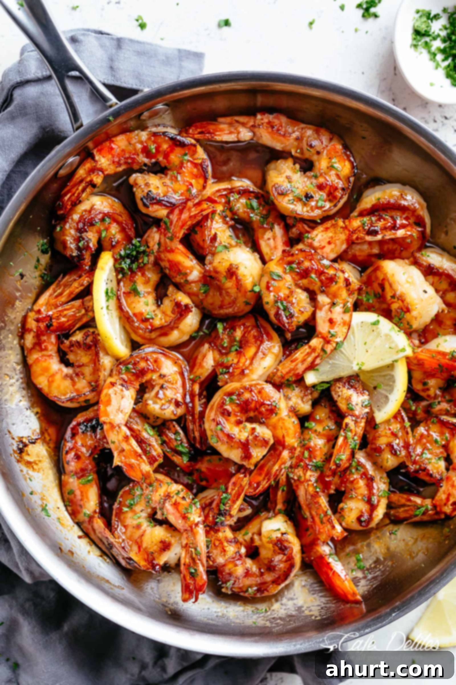 Honey Garlic Shrimp 2 Seared Buttery Honey Garlic Shrimp coated in the best honey garlic butter sauce is a quick and simple shrimp recipe guaranteed to impress!
