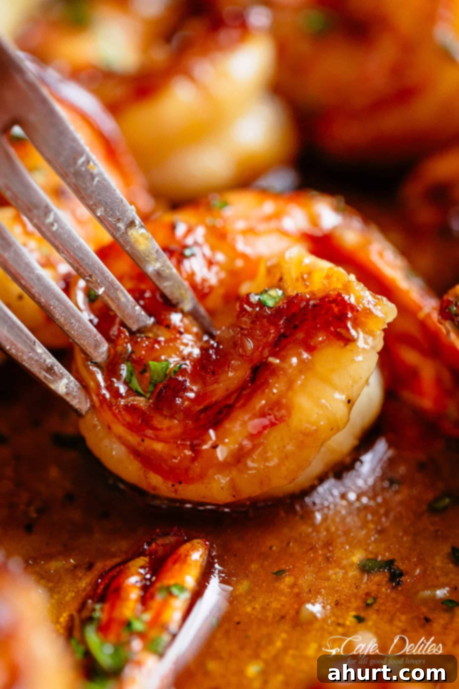 Shrimp recipes | cafedelites.com Fork pierced in Buttery Honey Garlic Shrimp