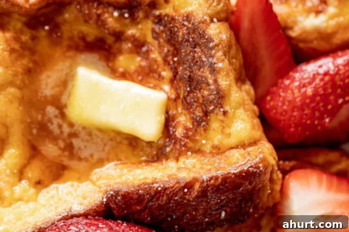 French Toast Perfection 7 Step 4: French toast slices cooking to golden perfection in a hot pan.