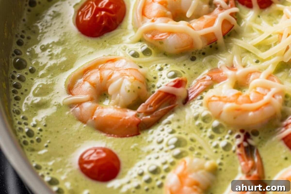 Creamy Pesto Alfredo Shrimp 6 Shrimp and tomatoes with thick sauce.
