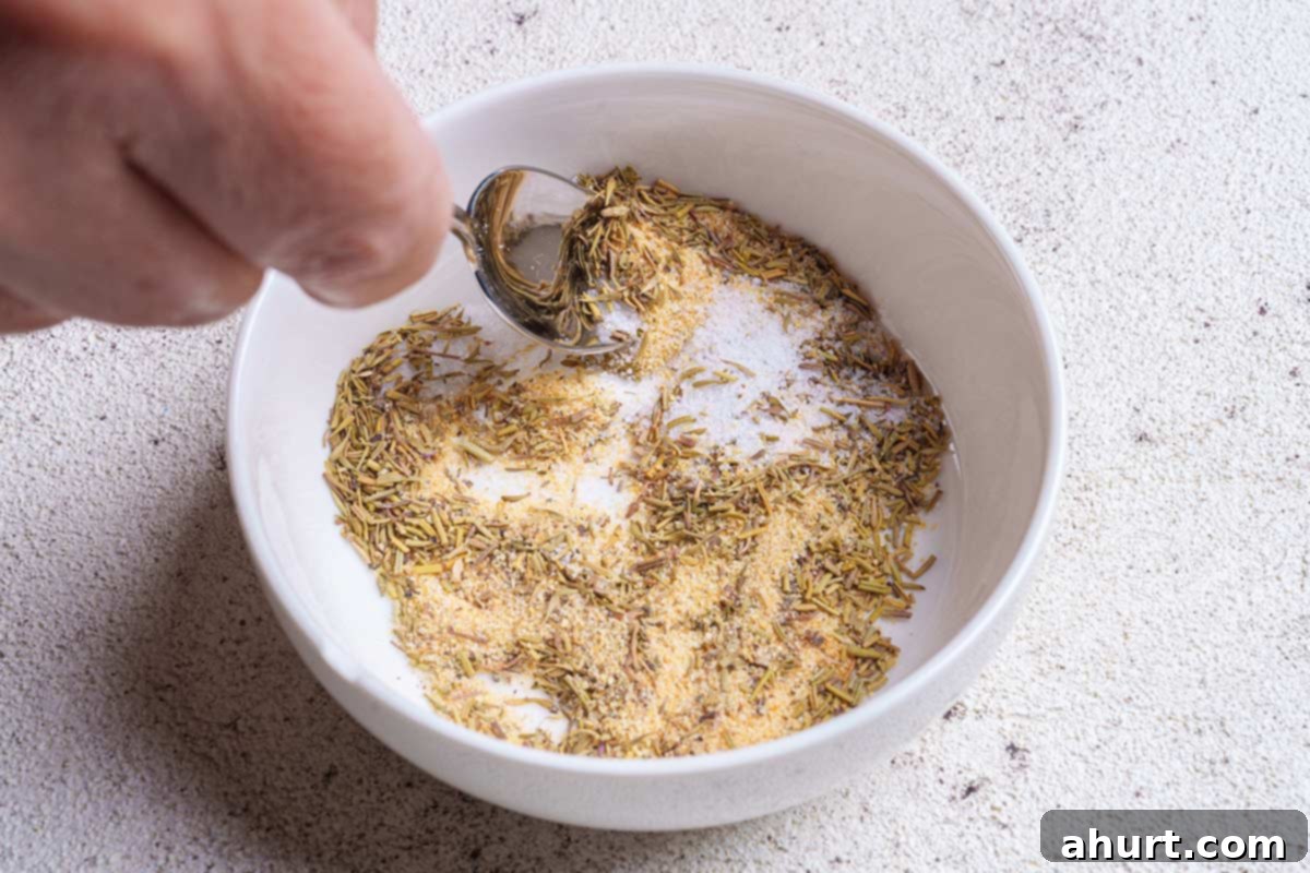 Creamy Mushroom Garlic Chicken Thighs 4 In a white bowl, onion powder, garlic powder, dried herbs, salt and pepper are combined