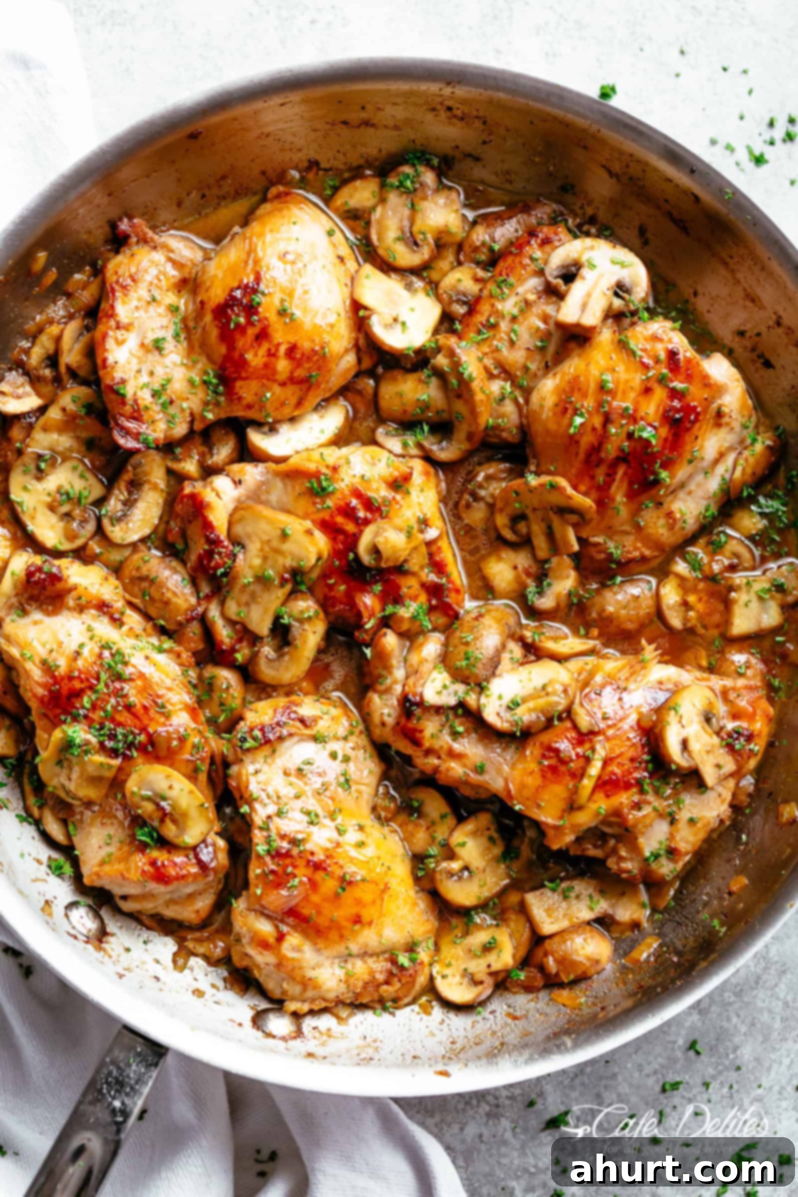 Garlic Mushroom Chicken Thighs | cafedelites.com Golden seared chicken thighs with buttery garlic mushroom sauce with a sprinkle of herbs. Served over rice, pasta, mashed potatoes OR lower carb options like mashed cauliflower or zucchini noodles! A perfect Garlic Mushroom Chicken Thighs dish.