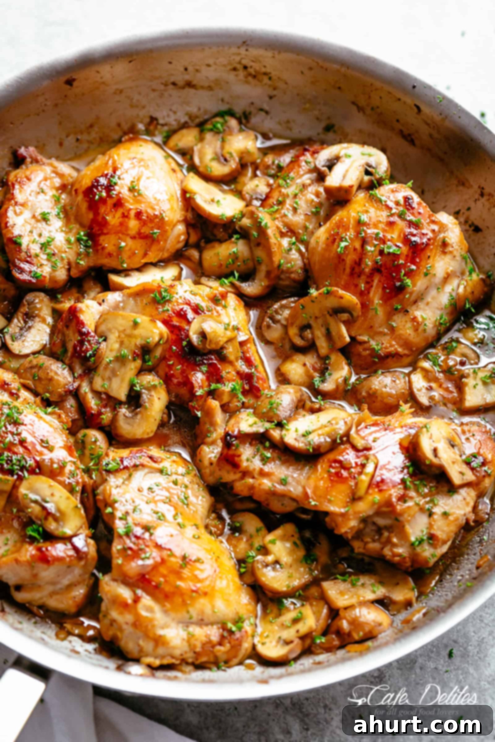 Garlic Mushroom Chicken Thighs | cafedelites.com Golden seared chicken thighs in a delicious, buttery garlic mushroom sauce with a sprinkle of herbs is THE weeknight dinner everyone raves about! Serve over rice, pasta, mashed potatoes OR lower carb options like mashed cauliflower or zucchini noodles!