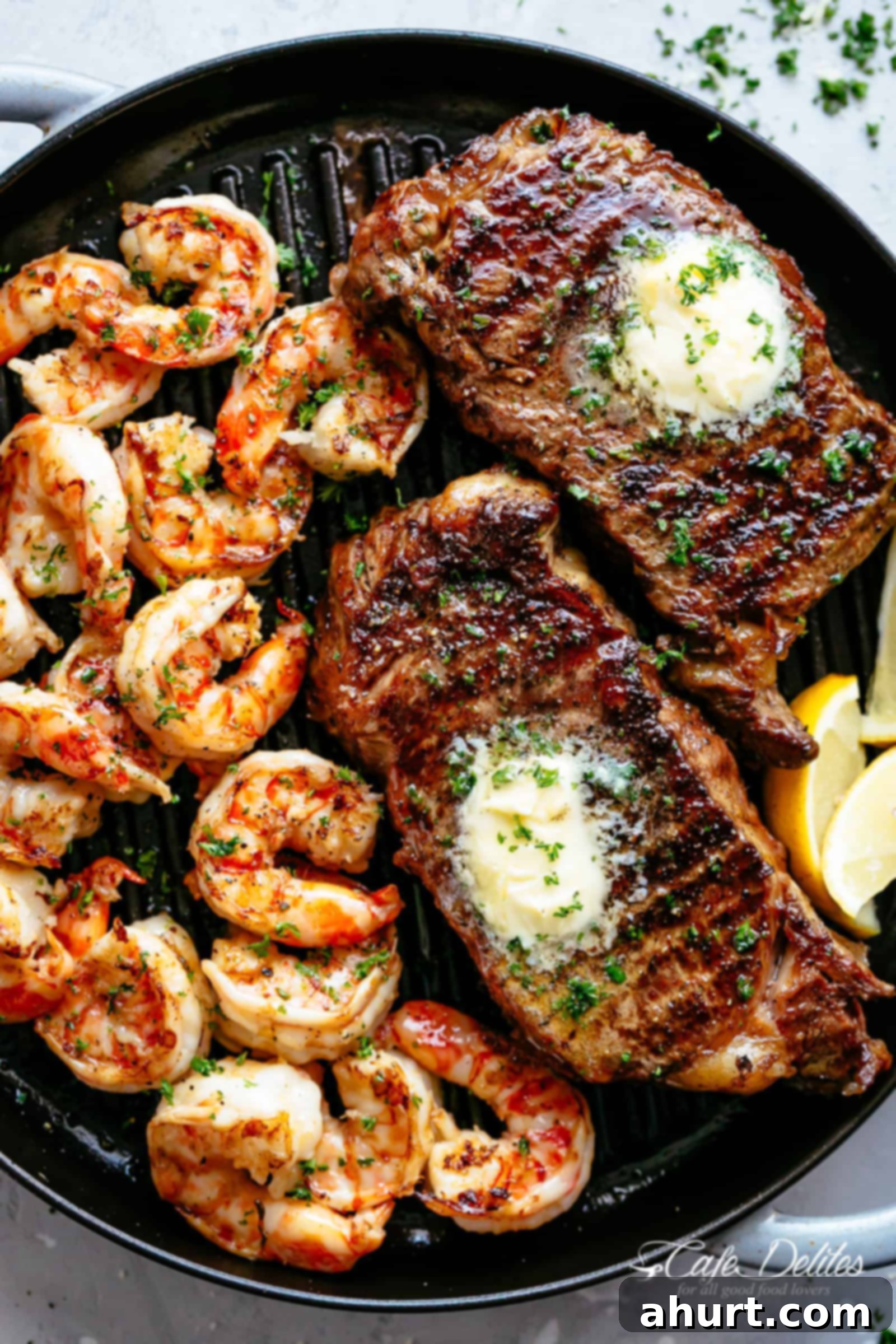 Grilled Steak Recipe | cafedelites.com Grilled Steak & Shrimp slathered in garlic butter.