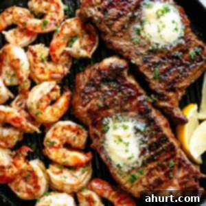 Sizzling Steak and Shrimp with Garlic Butter 2 Top view of Grilled Steak & Shrimp slathered in garlic butter.