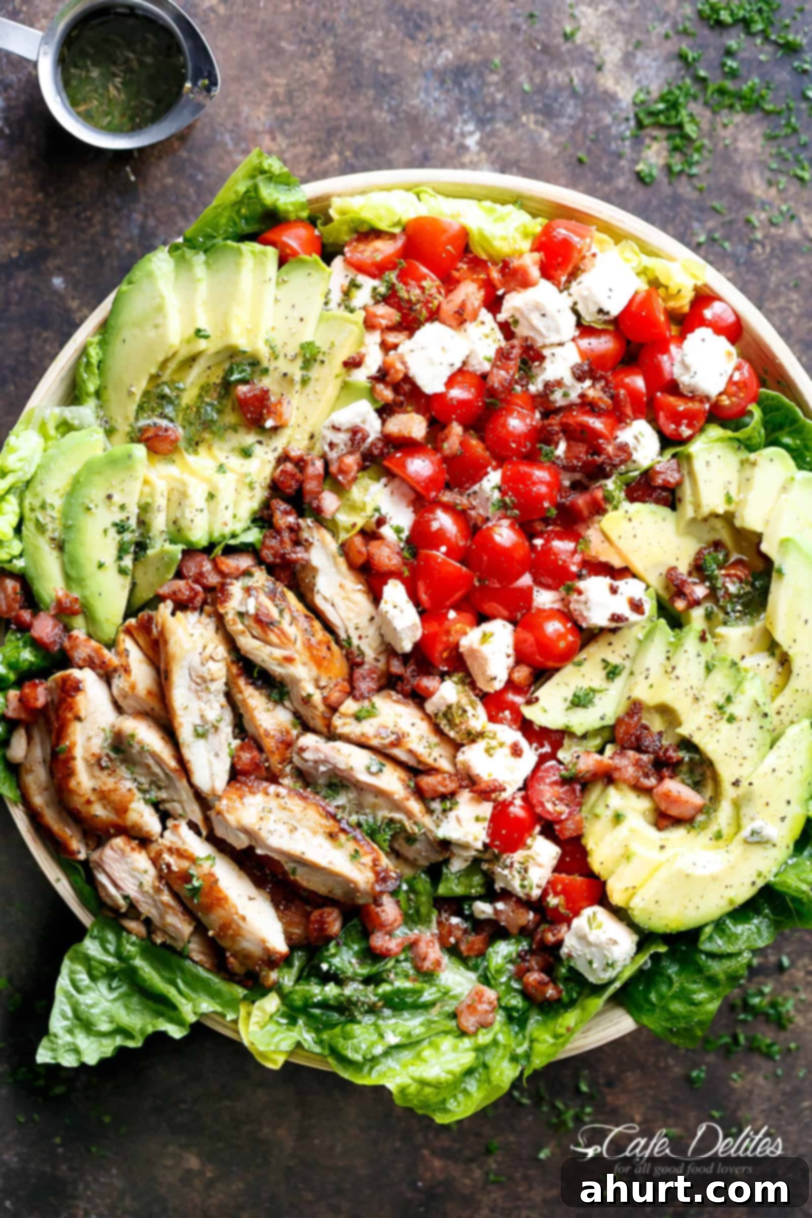 Lemon Herb Avocado Chicken Salad Recipe with crispy bacon & creamy feta cheese on a plate 