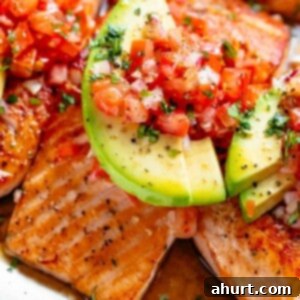 Pan-Seared Salmon with Zesty Avocado Tomato Salsa 2 Pan Seared Salmon in a buttery garlic lemon sauce, topped with a fresh tomato salsa and avocado slices!
