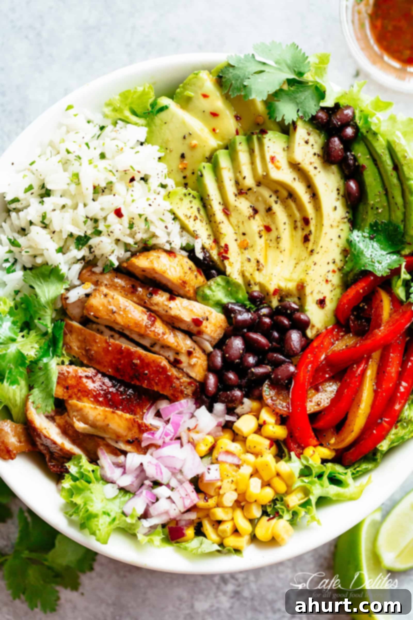 Fajita Chicken Burrito Bowl is packed with juicy golden chicken, cilantro lime rice, avocado and a delicious dressing