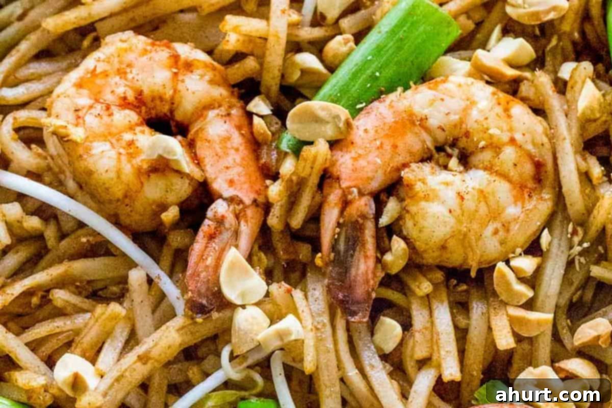 Classic Pad Thai 11 Pad Thai garnished with peanuts and lime wedges ready to be served