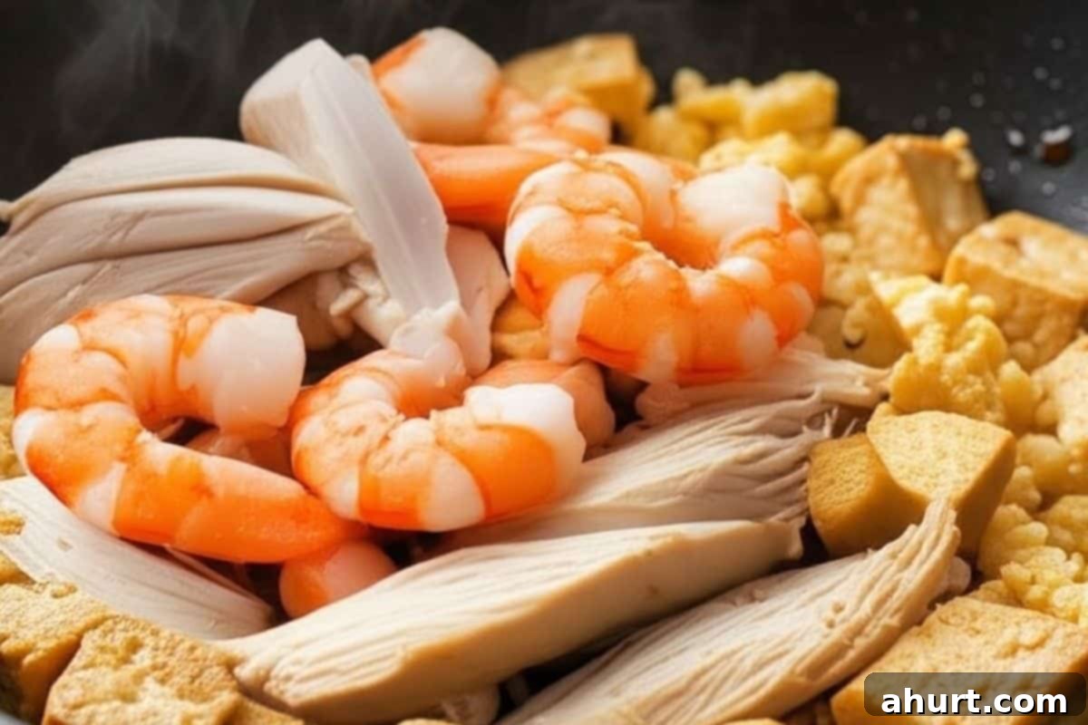 Classic Pad Thai 7 Add sliced chicken and shrimp to the wok and cook until fully opaque