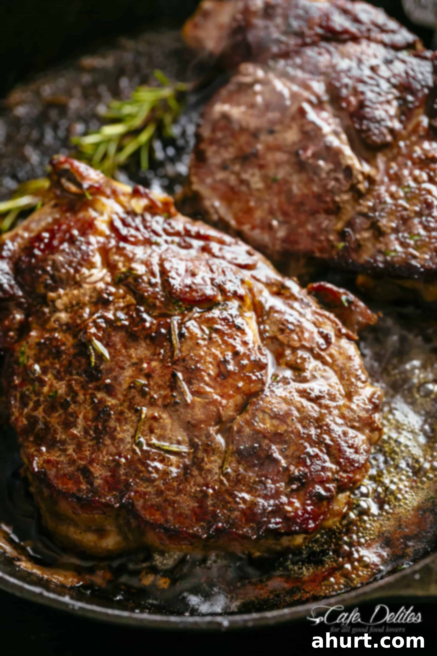 The Steakhouse Masterpiece 2 Garlic Butter Basted Steakhouse Steak piece on a pan