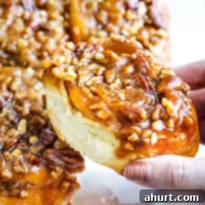 Gooey Maple Pecan Sticky Buns 6 Close-up of a maple pecan sticky bun, soft, sweet, and perfectly sticky.