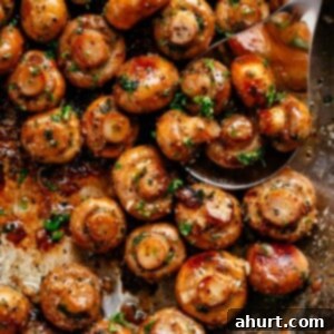 Golden Garlic Butter Mushrooms 11 Garlic Mushrooms with sauce in a pan