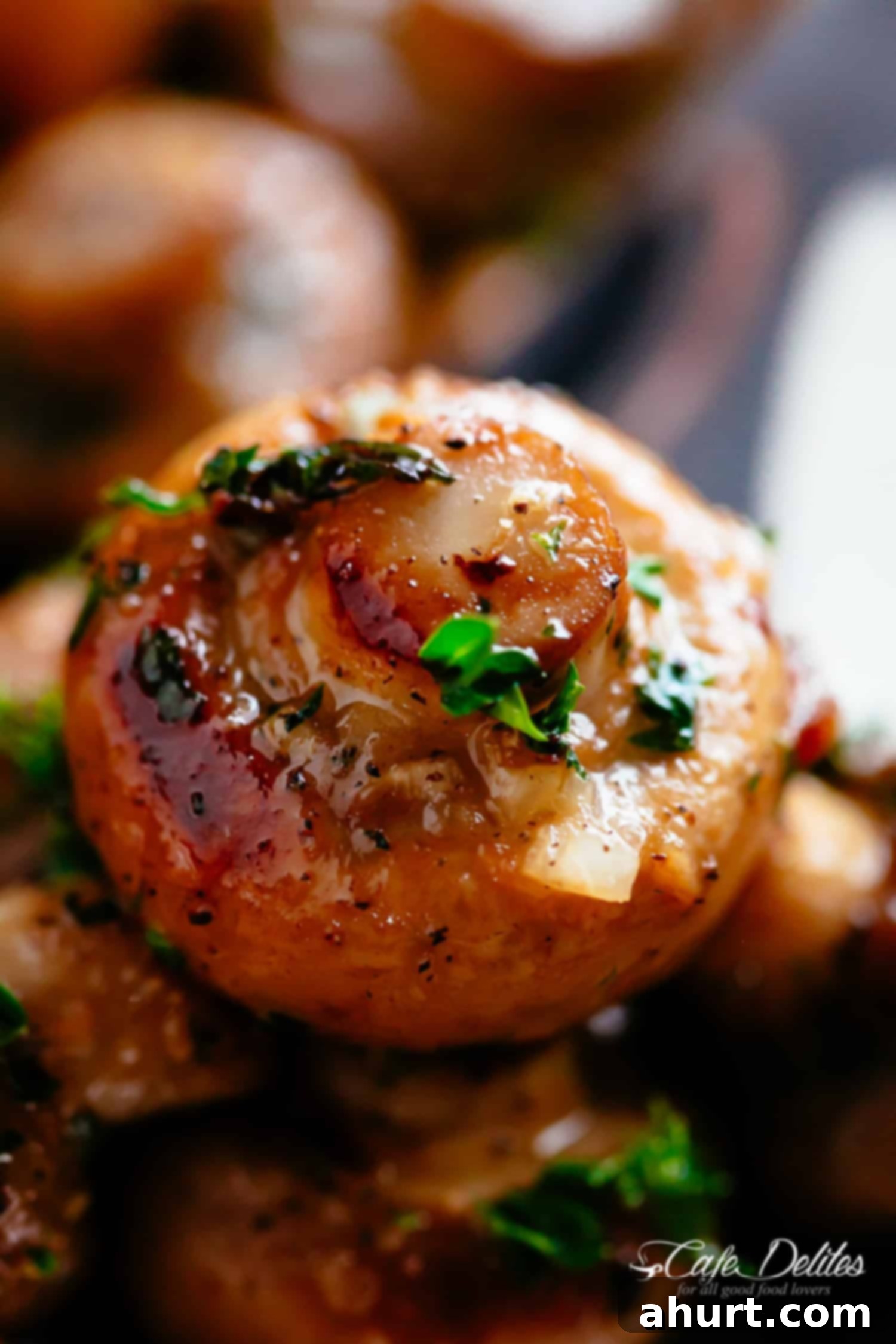 Golden Garlic Butter Mushrooms 10 Close-Up image of garlic mushrooms in buttery garlic sauce.