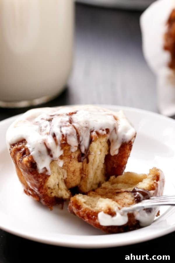 A bite taken from No Yeast Choc Chip Cinnamon Rolls 