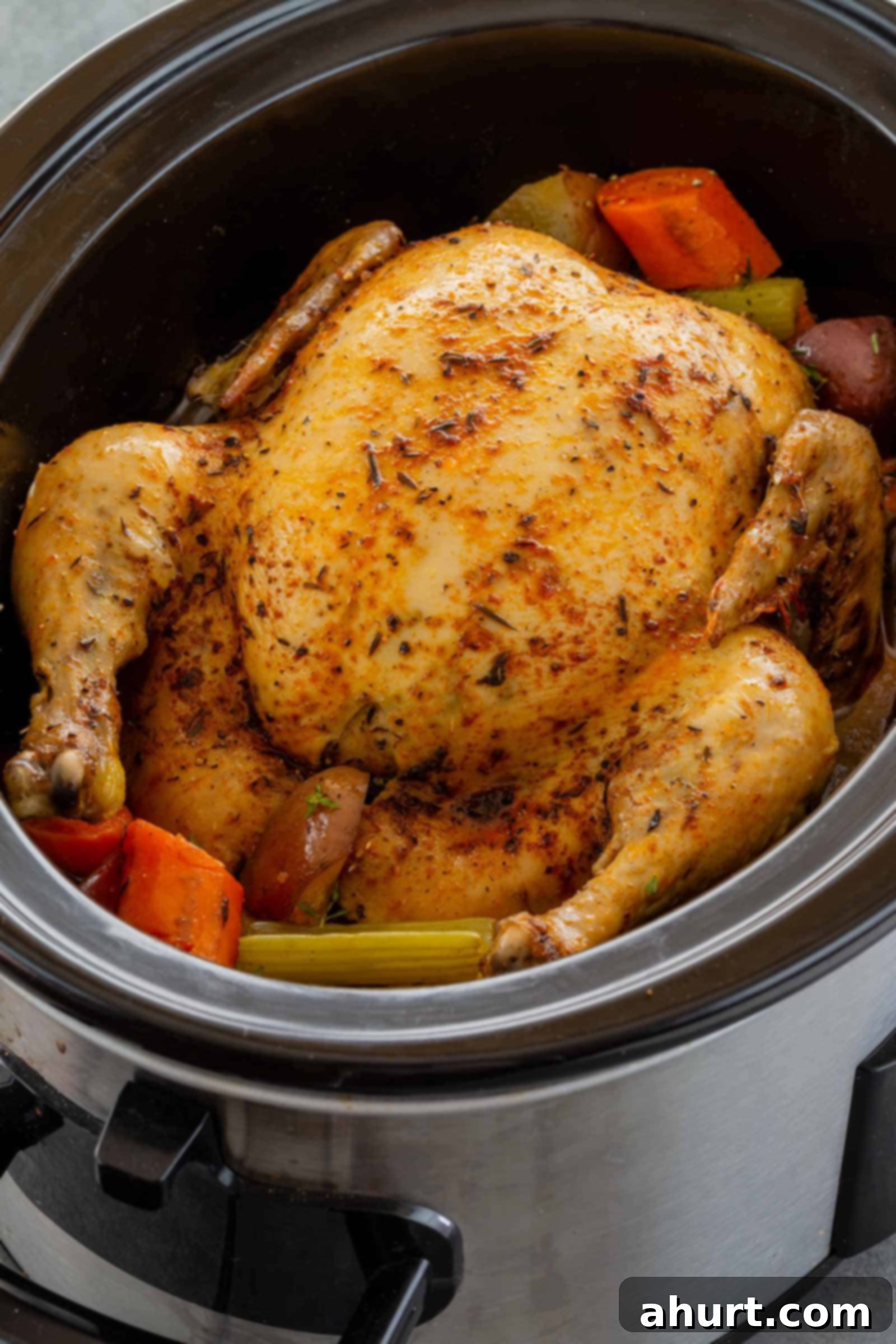 The Best Slow Cooker Whole Chicken 5 Half cooked full size chicken in a pot, almost ready