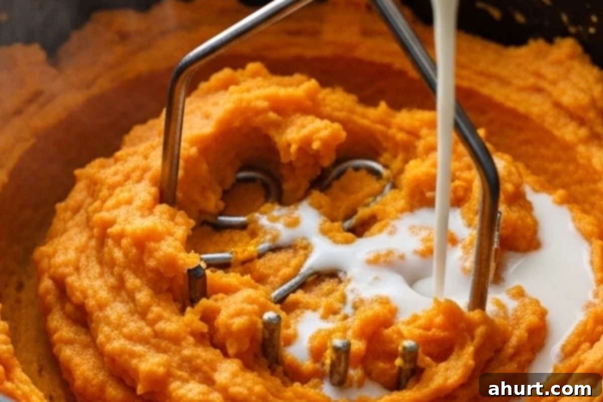 Garlic Herb Savory Sweet Potato Mash 6 Mash everything using a potato masher until smooth. Add milk if you want a creamier texture.