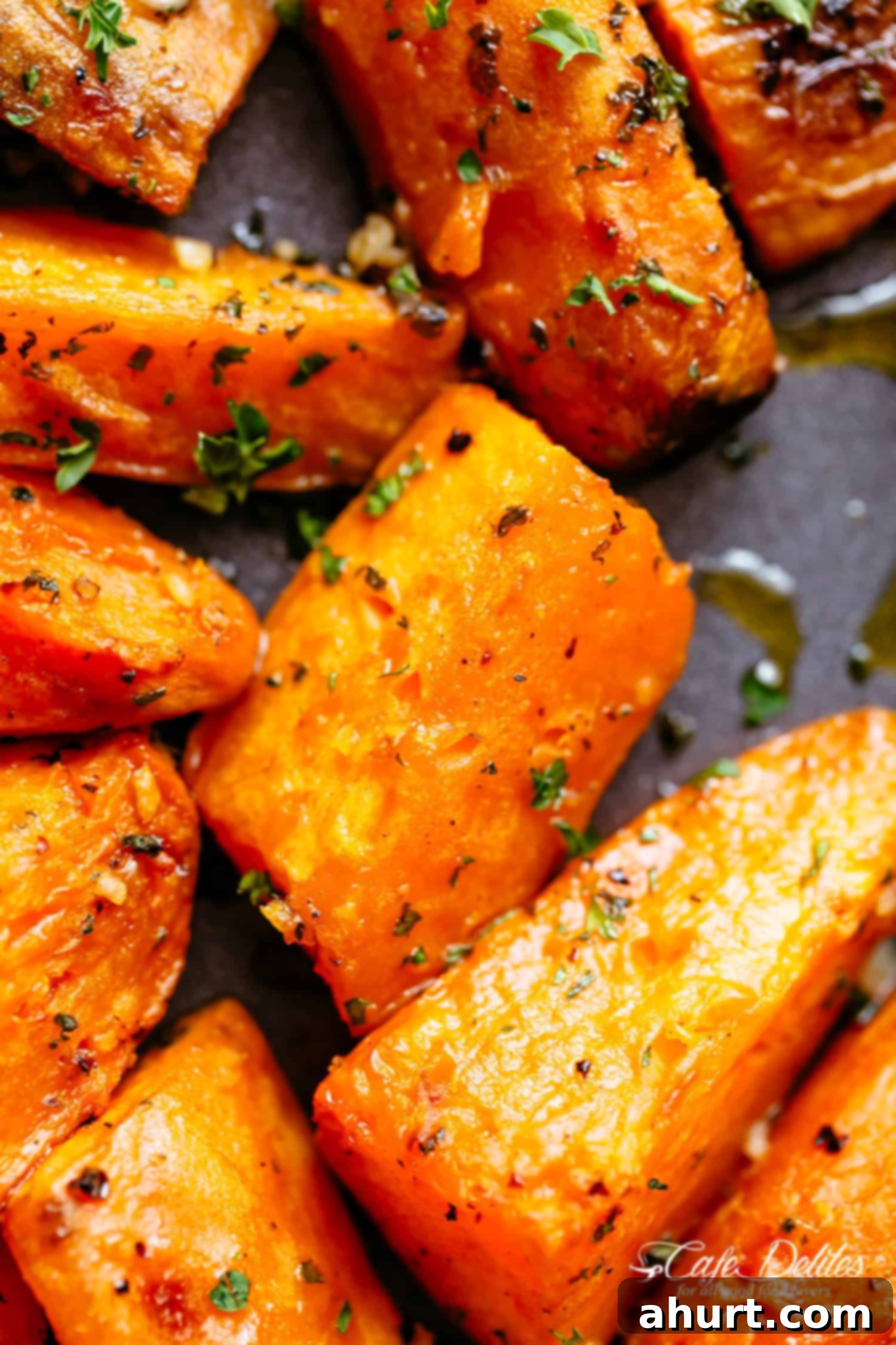 Zoom in image of Roasted Sweet Potatoes with garlic, herbs and olive oil.