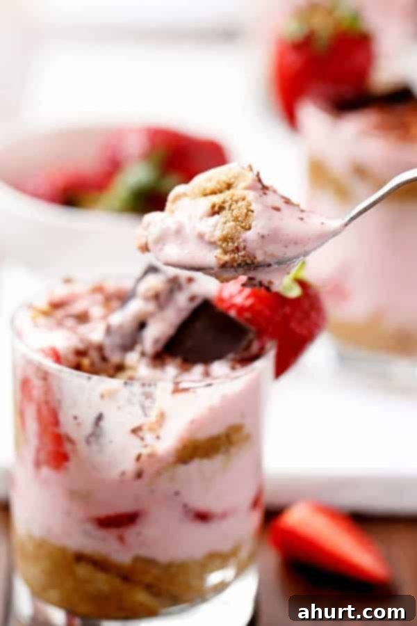 Luscious Strawberry Tiramisu Parfait 3 Spoon carrying some Strawberries and Cream Tiramisu Parfait