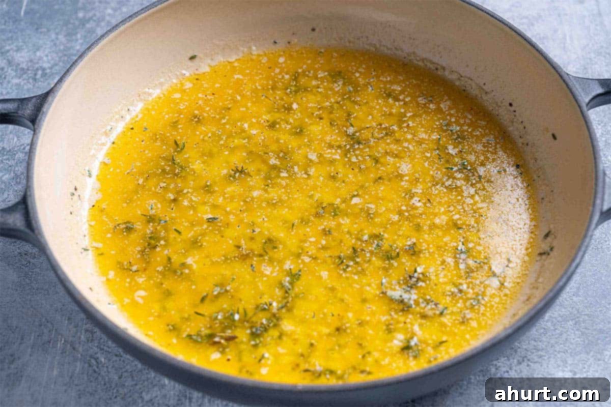 Perfect Herb Butter Roasted Turkey 5 herb butter mixture, melted butter, minced garlic, chopped fresh thyme, salt, and pepper in a pan.