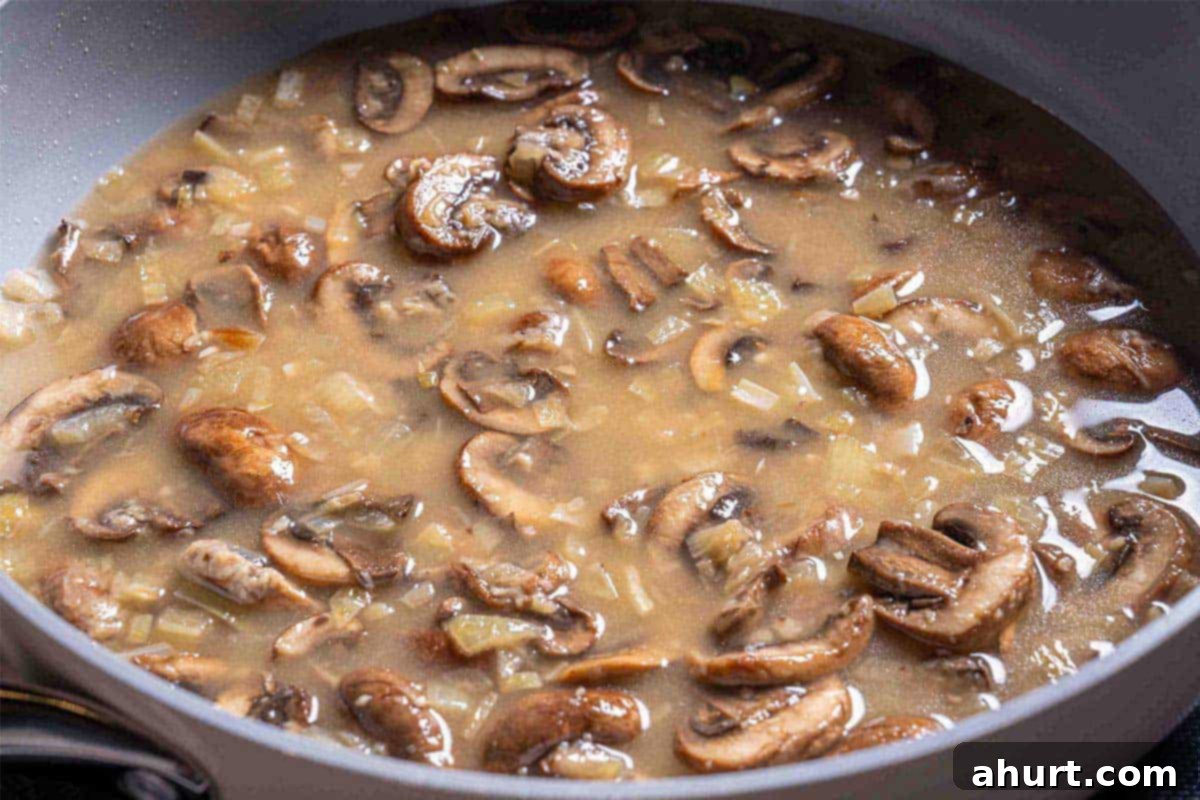 Velvety Green Bean Casserole with a Golden Crunch 7 mushroom soup simmering in a pot