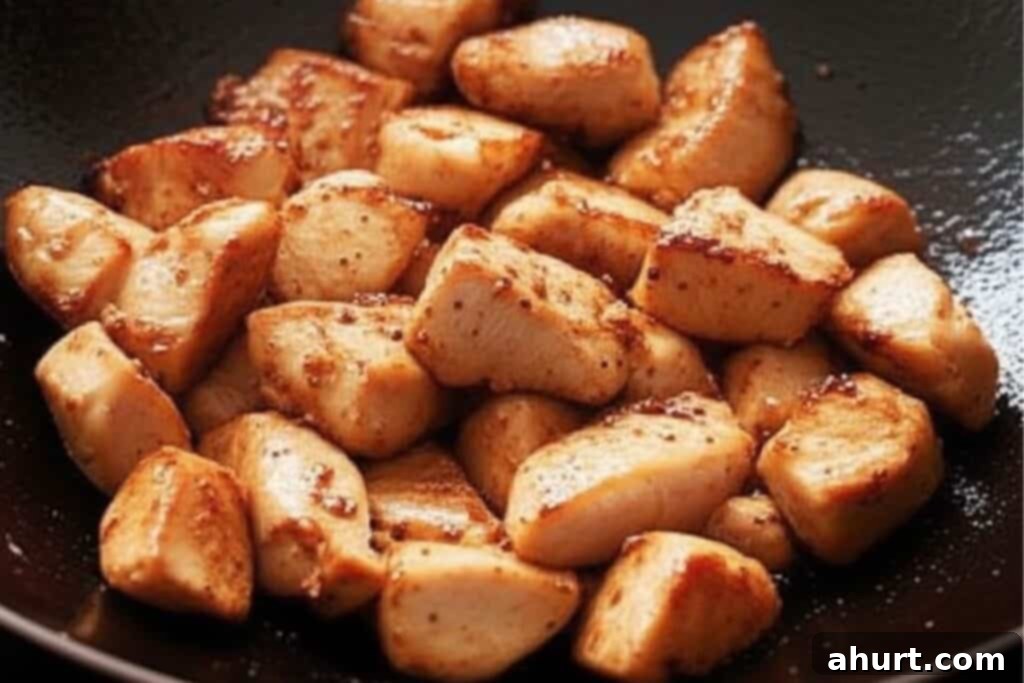 Quick and Delicious Teriyaki Chicken Stir Fry 5 Step 2: Searing bite-sized chicken thighs until golden and lightly crisp in a hot pan with sesame oil