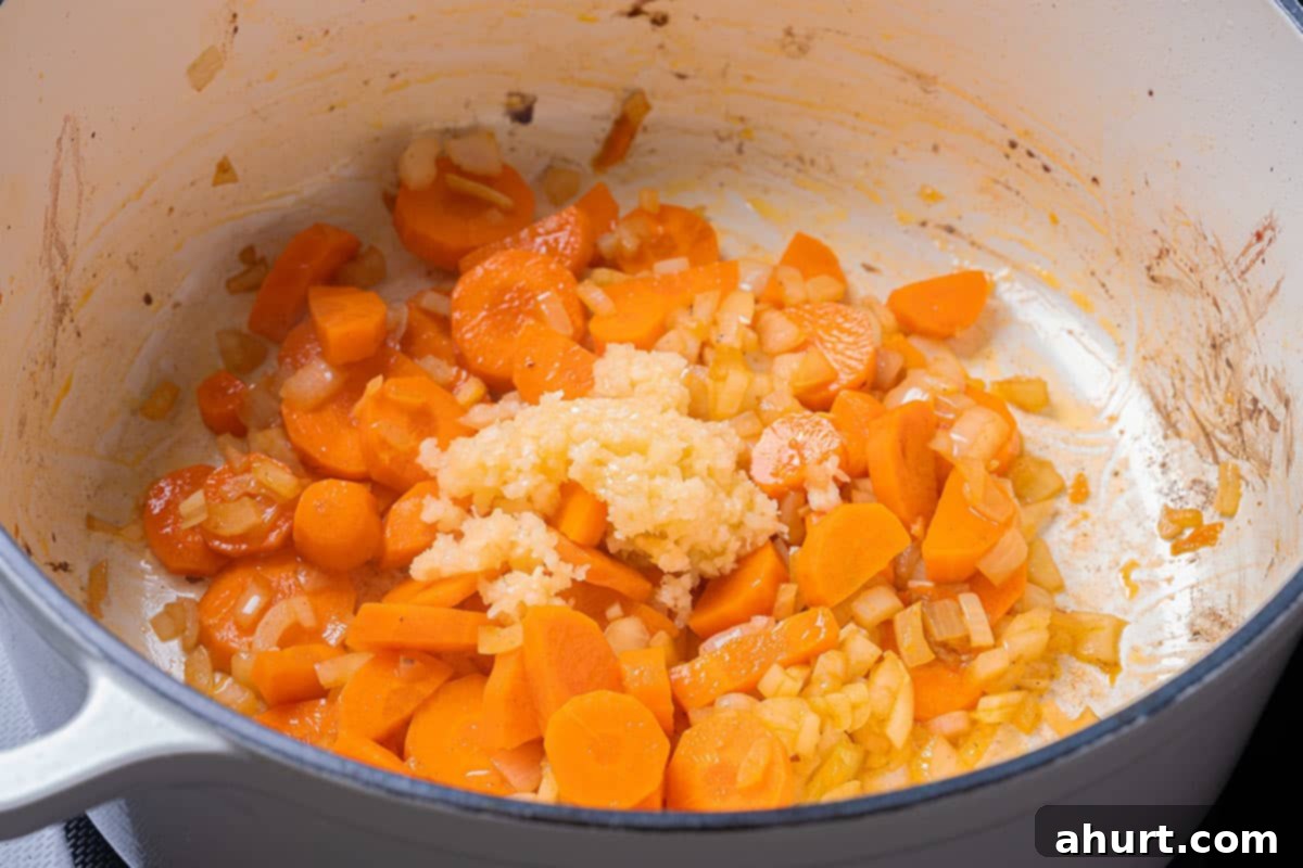 Fall-Off-The-Bone Lamb Shanks 6 Sautéing carrots and diced onion in the same pot with pan juices.
