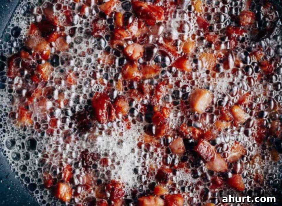 Bacon cheese dip Frying image of bacon in a skillet