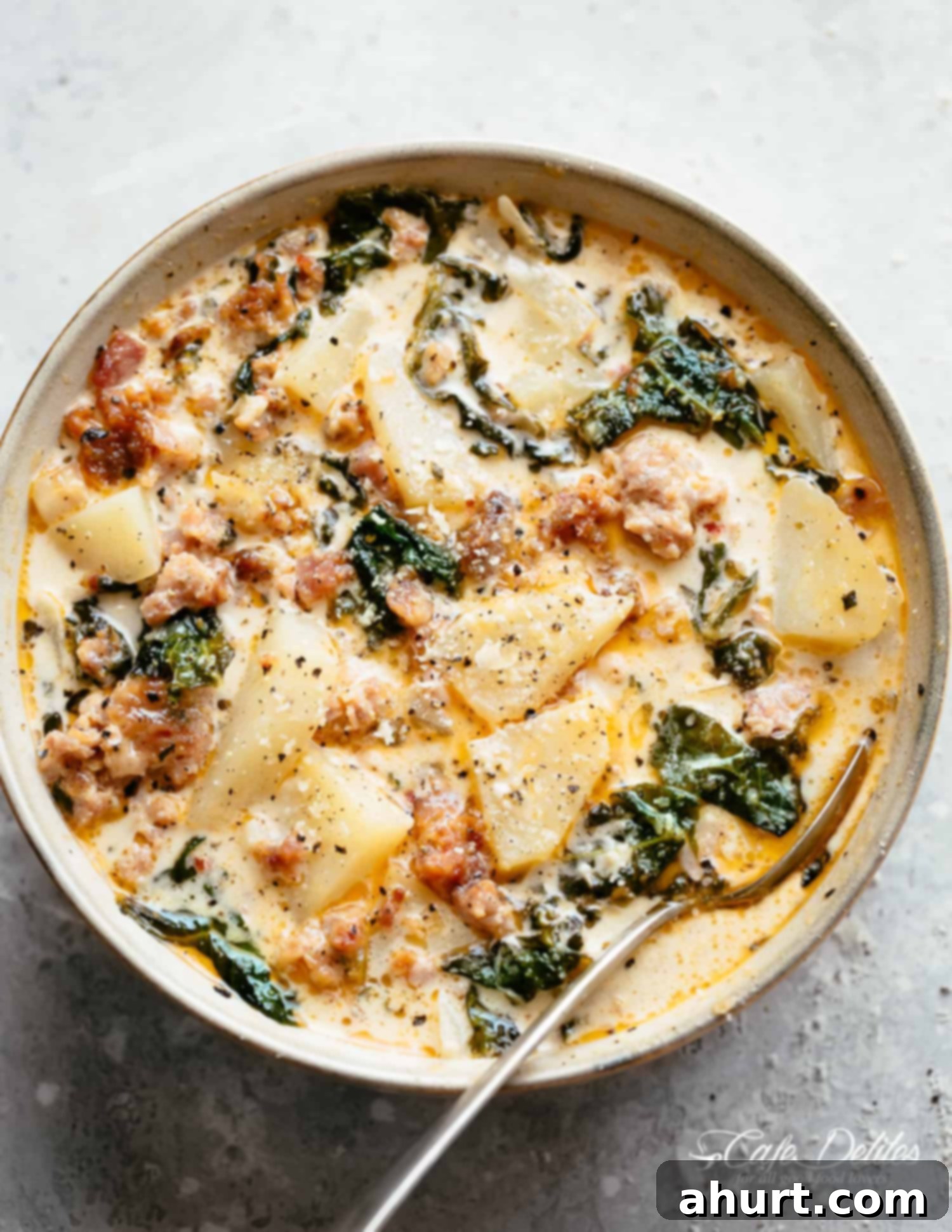 Zuppa Toscana recipe with sausage, bacon, kale and potatoes | cafedelites.com A bowl of Zuppa Toscana with sausage, bacon, kale and potatoes