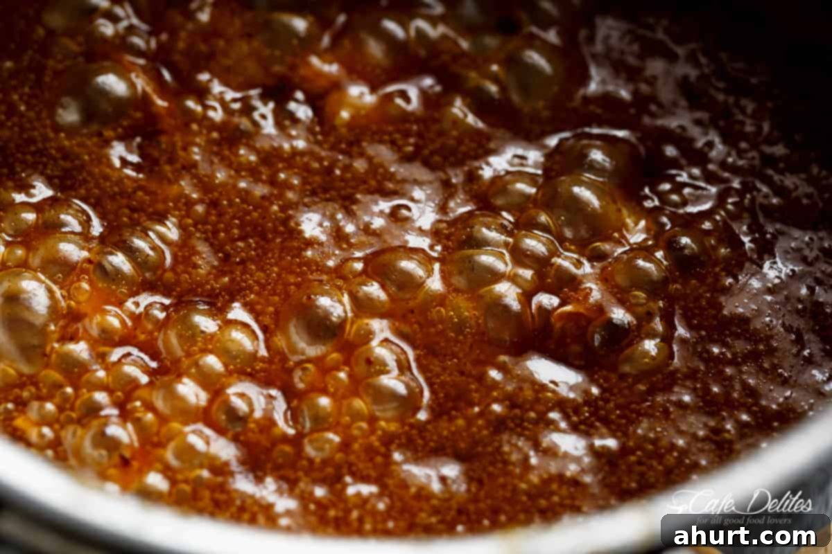 Simmering pot of honey glaze for ham #cafedelites #glaze #honey Making of Honey glaze for ham