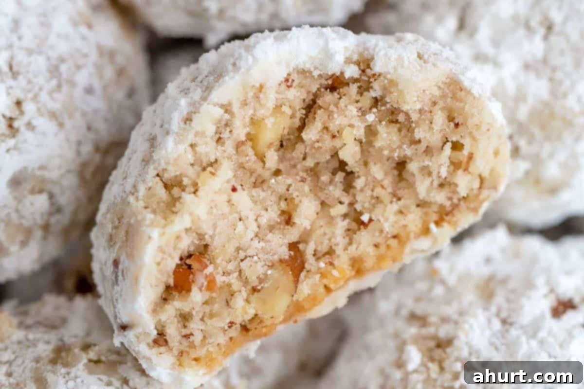 Frosted Nutty Bites 11 Let the cookies cool and roll them in powdered sugar.