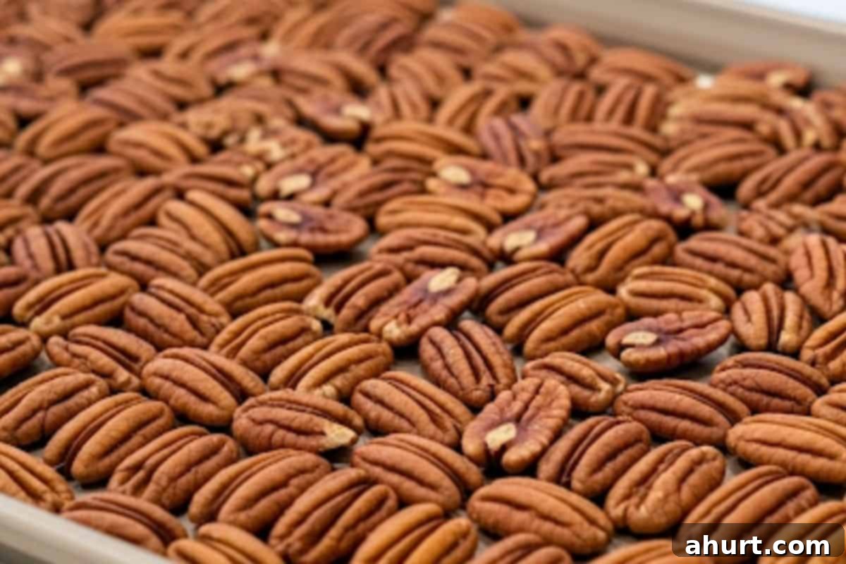 Frosted Nutty Bites 5 Spread the pecans on a baking sheet and toast for 6 minutes in the oven.