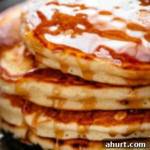 Fluffy Buttermilk Pancakes 2 Buttermilk Pancakes with dripping maple syrup