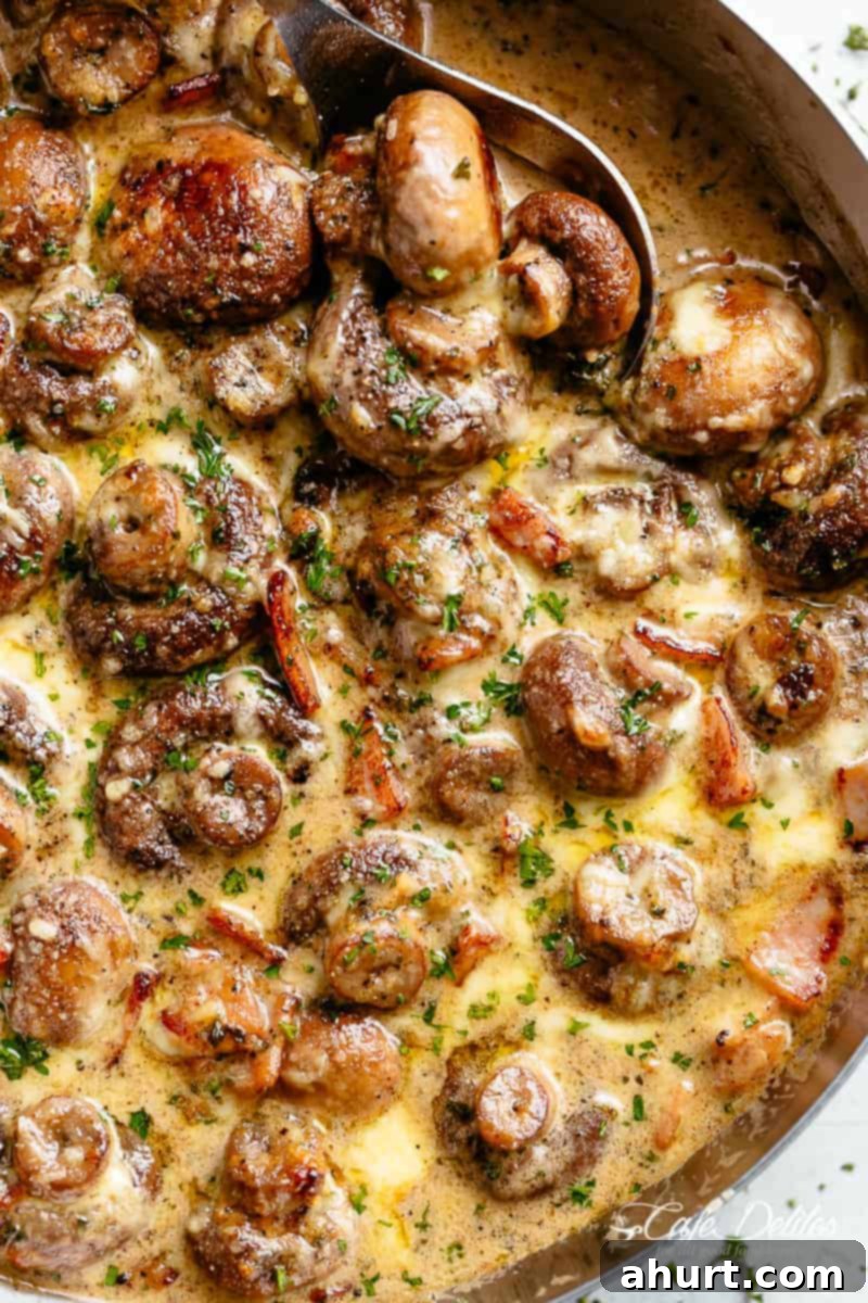 Mushroom recipe #cafedelites #mushroom #recipe Sautéed Mushroom recipe with cheese, cream and bacon in a skillet