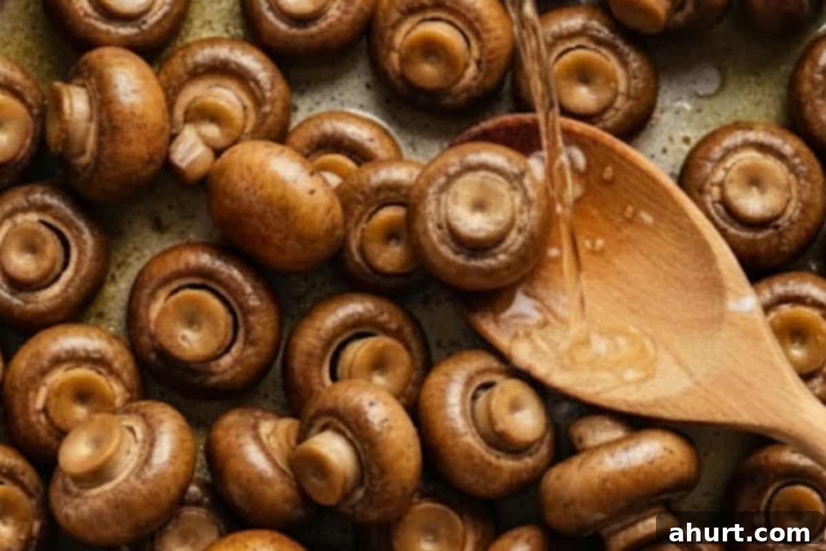 Creamy Garlic Mushrooms 5 Pour in white wine into the pan