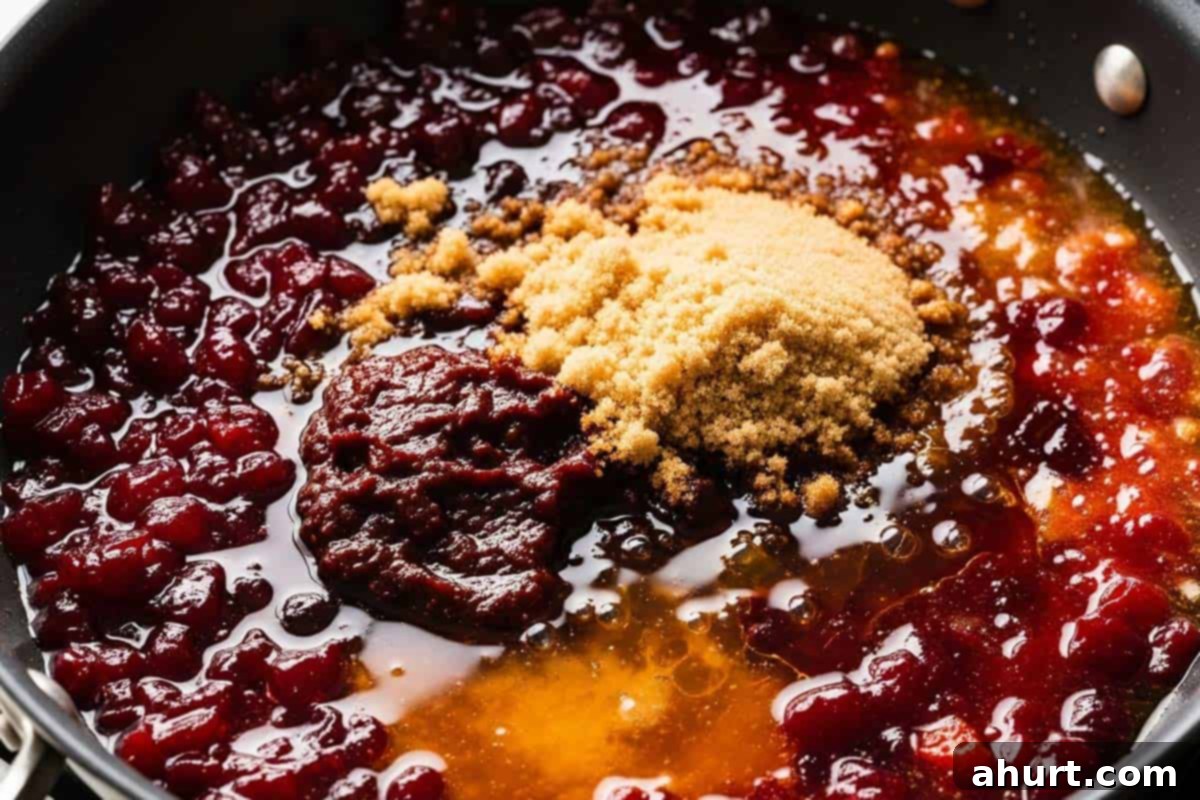 Tangy Glazed Party Meatballs 7 Cranberry sauce, chili sauce, brown sugar, and vinegar in a large skillet.