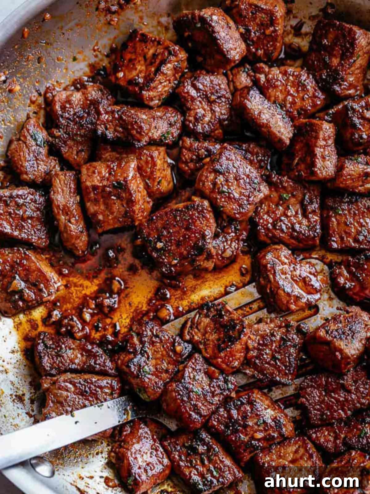 Irresistible Cajun Butter Steak Bites 2 Top view image of Tender pan seared Cajun Butter Steak Bites are full flavored with crispy edges in a pan