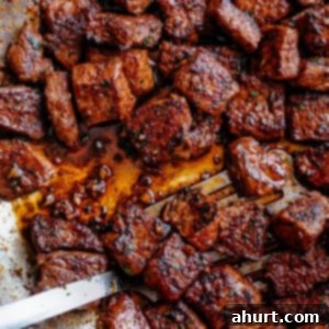 Irresistible Cajun Butter Steak Bites 11 Top view image of Tender pan seared Cajun Butter Steak Bites are full flavored with crispy edges in a pan