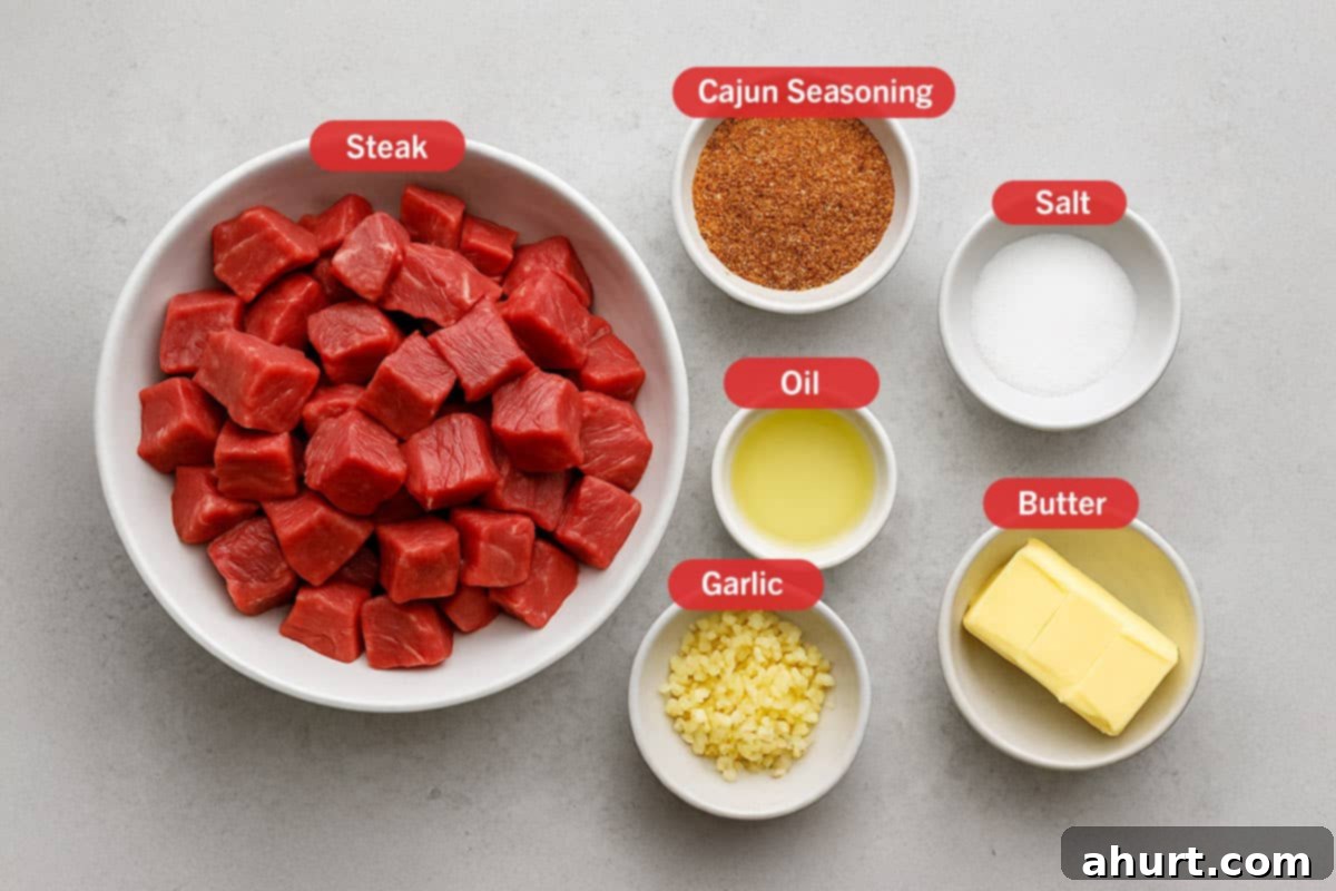 Irresistible Cajun Butter Steak Bites 3 ingredients laid out against a white backdrop