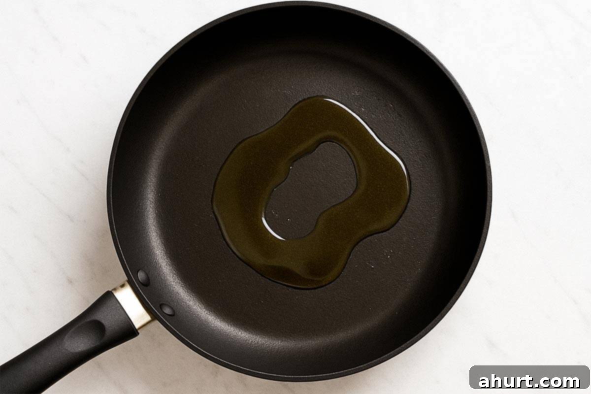 Irresistible Cajun Butter Steak Bites 5 empty pan with oil being heated