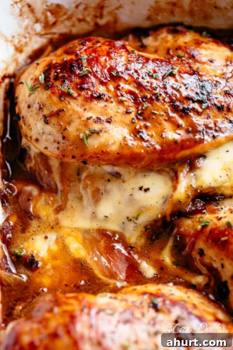 Stuffed chicken with cheese #cafedelites #stuffedchicken #chicken Side view zoom in image of French Onion Stuffed Chicken with caramelized onions and melted cheese oozing out.
