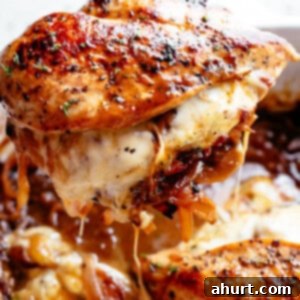 Caramelized Onion Stuffed Chicken 2 French Onion Stuffed Chicken piece being pulled out of casserole